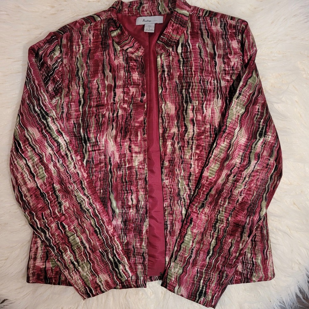 large funky coat and green tank